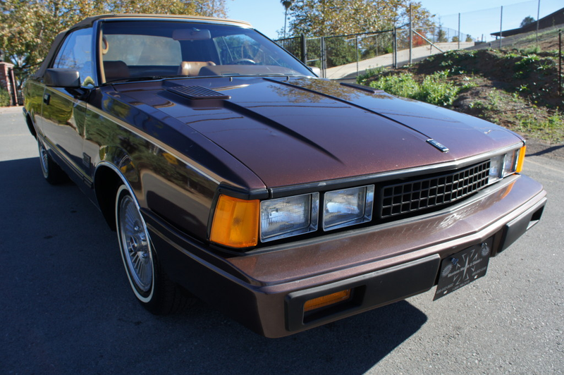Illustration for article titled For $6,500 — top down and brown, loaded up and Datsun